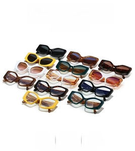 Detailed flat lay of trendy cat-eye and geometric sunglasses in multiple stylish colors