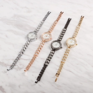 Detailed display of luxury women's mermaid watches in silver, rose gold, black, and gold