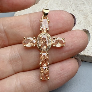 Champagne zircon cross pendant necklace in gold finish with sparkling micro-pave stones