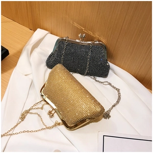 Detailed close-up of luxury rhinestone evening bags with metal chain and clasp
