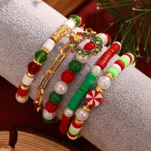 Detail of Christmas beaded bracelet set featuring festive pendants and colorful beads