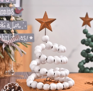 Detail of wooden bead spiral Christmas tree with rusty brown metal star on top