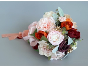 Detail of bridal bouquet with pink and burgundy roses, eucalyptus leaves and silk ribbons