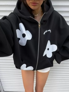 Oversized black floral print hoodie with zip closure and white flower patterns