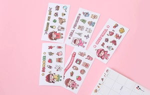 Detailed close-up of colorful cartoon PVC stickers with cute space and flower themes