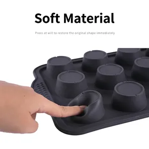 Flexible 12-cup silicone muffin pan in dark grey showing quick bounce back and soft texture