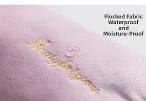 Close-up of pink flannel fabric with gold embroidery and waterproof water droplets