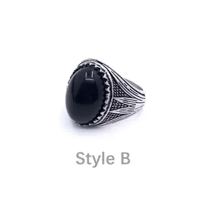 Macro shot of Style B vintage men's ring with black gemstone and leaf textured details
