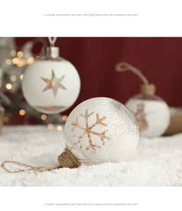 Detail of white Christmas glass ball with snowflake patterns and rustic jute rope hanging