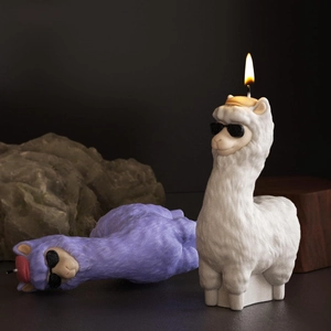 Artistic detail of alpaca silicone mold candles featuring sunglasses and decorative hats