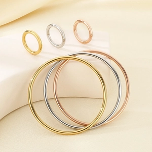 Minimalist stainless steel ring and bangle set in gold, silver, and rose gold finishes
