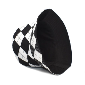 Close-up of black and white checkered bucket hat showing the contrast inner lining