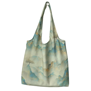 Artistic tote bag with Chinese landscape painting design shown in a hanging pose