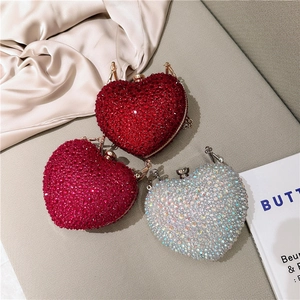 Elegant heart-shaped rhinestone evening clutch with chain in red and silver tones