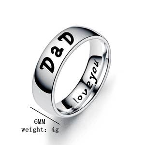 Detailed macro shot of 6MM silver Dad ring engraved with I love you on inner band