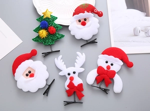 Selección de clips navideños para el pelo con Papá Noel y renos en muelles metálicos