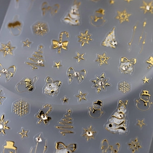 Luxurious gold Christmas nail stickers featuring snowflakes and Xmas tree motifs