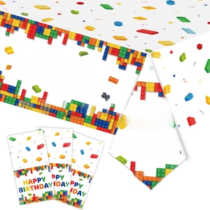 Close-up of building blocks party supplies including tablecloth and Happy Birthday tableware
