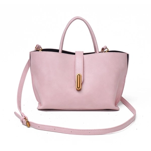 Elegant pink leather tote bag with gold capsule lock and adjustable shoulder strap