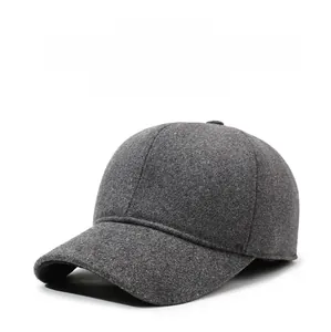 Detailed view of dark grey winter baseball cap with plush lining and metal shield emblem