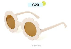 Side view of cream flower-shaped sunglasses with brown lenses and sunflower petal frame