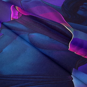 Macro detail of velvety microfiber fabric featuring abstract artistic female portrait print