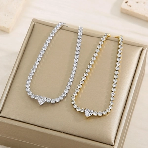 Detailed close-up of heart-shaped tennis necklace with zircons on jewelry display box