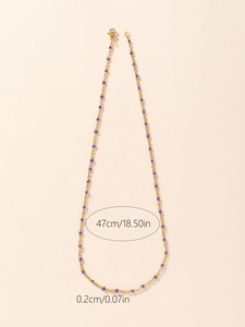 Detailed view of 47cm gold enamel bead chain necklace with size measurements
