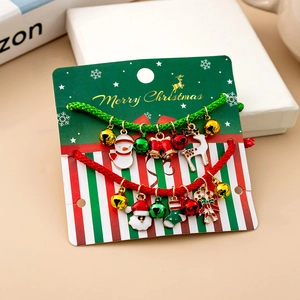 Detailed view of handmade woven Christmas bracelets with festive charms on display cards