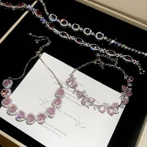Elegant zircon heart and geometric pendants bracelet set with silver finish on velvet