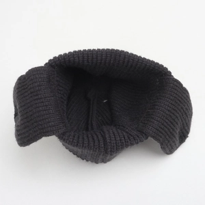 Detailed interior view of soft knit earflap hat showing thick black yarn structure