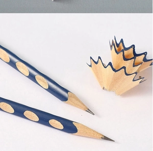 Macro view of blue triangular pencil with ergonomic grooves and sharpened wood tip