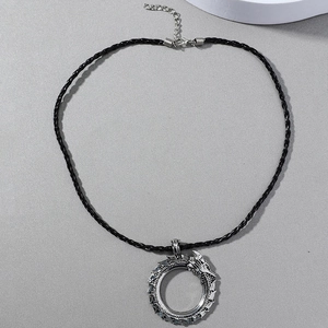 Vintage Viking dragon pendant necklace with silver circular dragon on black woven cord