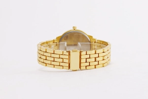 Polished gold metal watch band featuring a brick-link structure and secure folding clasp