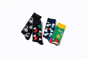 Detailed flat lay of four cotton crew socks featuring Christmas snowmen and pug patterns
