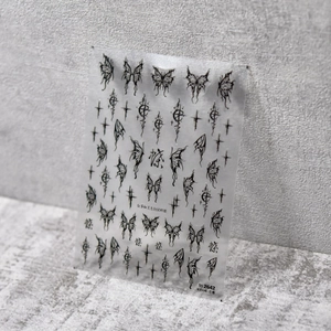 Detail of 5D embossed dark gothic butterfly and cross nail art stickers in matte black