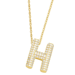 Macro shot of gold H letter pendant featuring pave-set zircon details on a chain