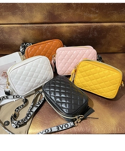 Detailed display of five small crossbody bags in various colors with embroidery textures
