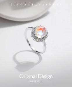 Detail of S925 silver ring with a 2-carat iridescent moonstone and halo diamond setting