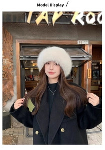 Outdoor model display of a fluffy white faux fur bucket hat with soft plush texture