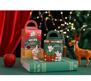 Detail of red and green Christmas gift boxes with cartoon illustrations and handles