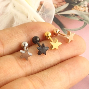 Set of four star-shaped stainless steel tragus earrings in silver, gold, and black colors