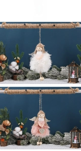Detail of plush Christmas angel pendants with gold wings in pink and white tones