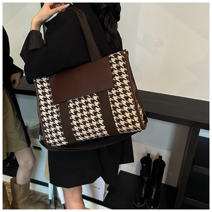 Detail of vintage houndstooth tote bag showing large capacity and brown PU leather flap