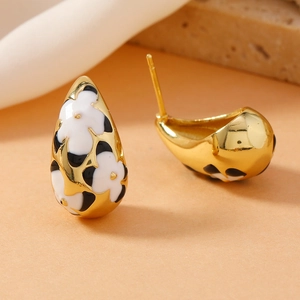 Vintage gold teardrop earrings with enamel daisy patterns and punk twisted metal design