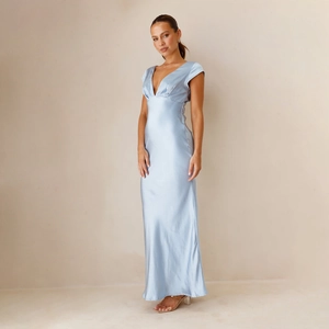 Detail view of the sleek deep V-neckline and smooth satin fabric of the light blue maxi dress