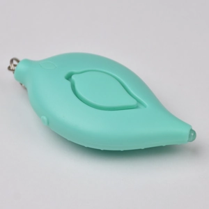 Macro detail of leaf-shaped turquoise personal safety alarm with keychain and LED light