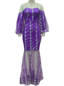Detail of purple sequin dress showing silver leaf embroidery and mesh lantern sleeves