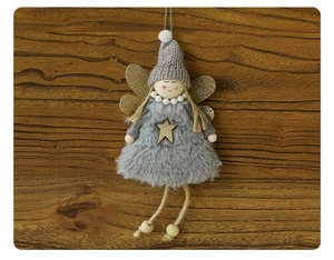 Detail of plush Christmas angel ornament in grey with gold wings and pearl necklace