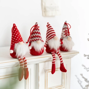Set of 4 Christmas gnomes with knitted hats and faux fur beards on a white shelf